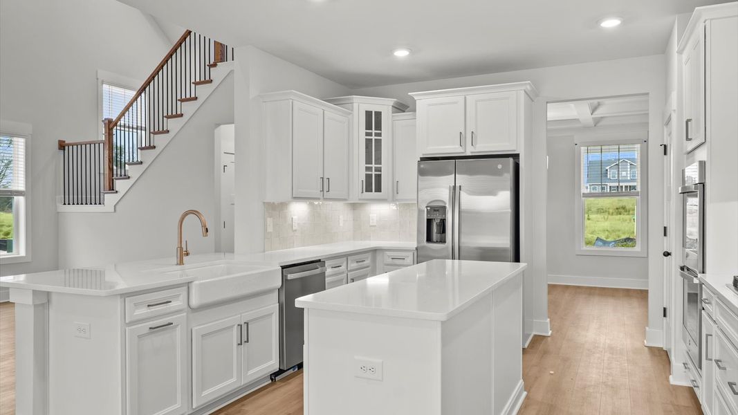 First-class finishes and a thoughtfully scaled island highlight this elegant kitchen space First-class finishes and a thoughtfully scaled island highlight this elegant kitchen space