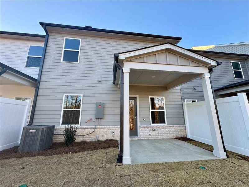 Exterior details and patio area of a home in Eastlyn Crossing, Flowery Branch (Image 3).