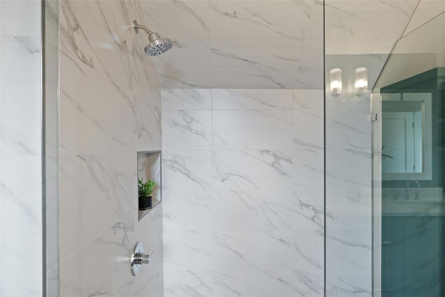 Bathroom with sink and a tile shower