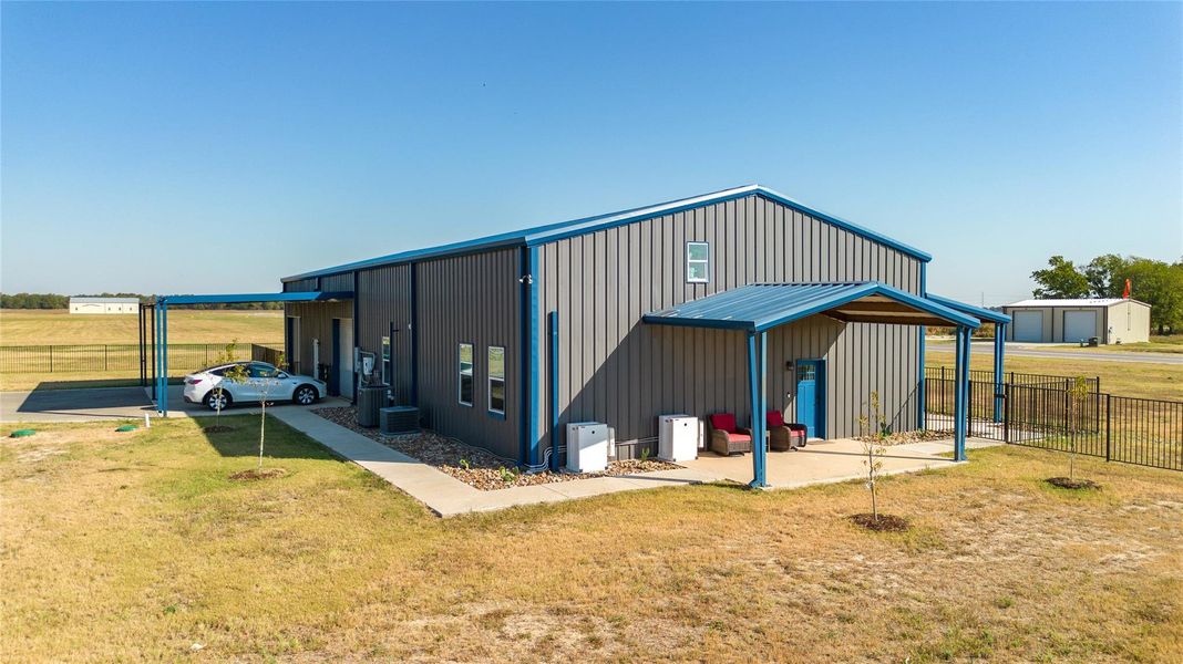 Covered side patio to enjoy views of the aviation community Covered side patio to enjoy views of the aviation community