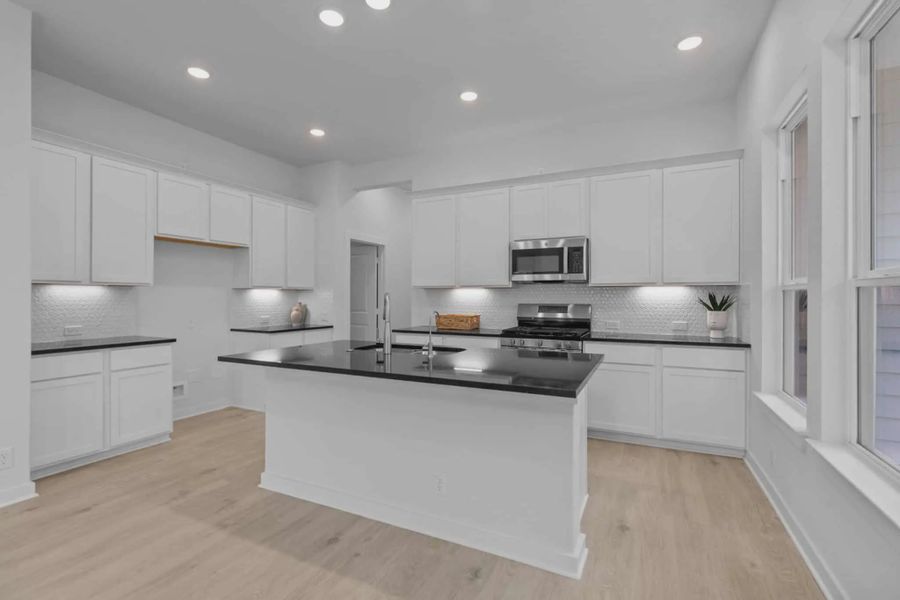Representative furnished interior of a home built from the Ryker by Chesmar Homes in The Crossvine, Forney (Image 3).