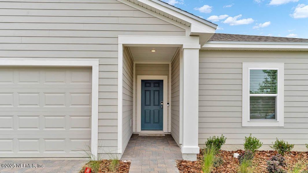 Front exterior of a new home in Coopers Meadow, Jacksonville, FL, highlighting curb appeal (Image 26).