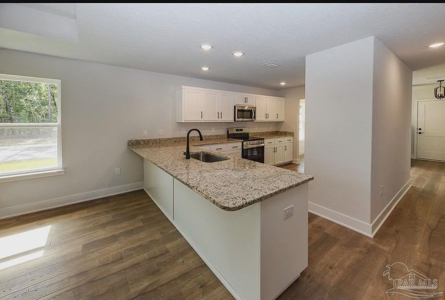Furnished interior view inside a new home in Hidden Pines, Milton (Image 6).