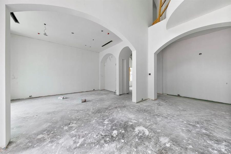 View of your dining room to the left as you walk in the front door. Take note of the grand archways that are featured throughout the home.