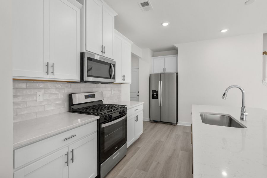 Furnished interior view inside a new home in Waterside - Boardwalk Series, Longs (Image 9).