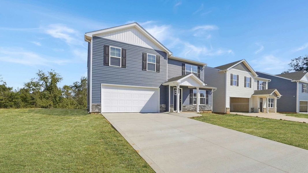 Front exterior of a new home in Johnson Farms, Greeneville, TN, highlighting curb appeal (Image 17). Front exterior of a new home in Johnson Farms, Greeneville, TN, highlighting curb appeal (Image 17).