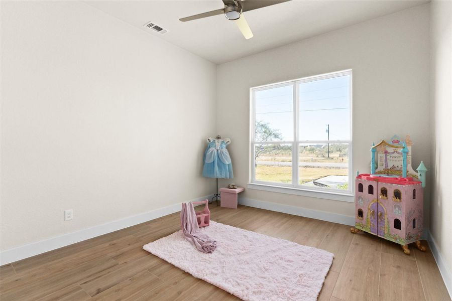 Rec room featuring light wood-style floors and ceiling fan