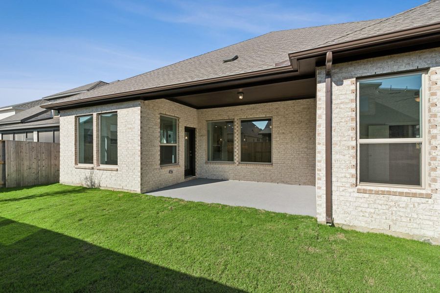 Exterior details and patio area of a home in Meridiana 55' Homesites, Manvel (Image 3).