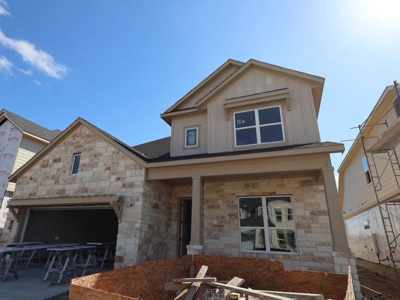 Front exterior of a new home in Barksdale, Leander, TX, highlighting curb appeal (Image 1). Front exterior of a new home in Barksdale, Leander, TX, highlighting curb appeal (Image 1).