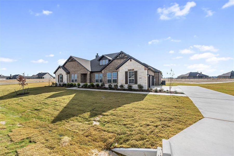 Front exterior of a new home in Eagle Ridge Estates, Weatherford, TX, highlighting curb appeal (Image 23).