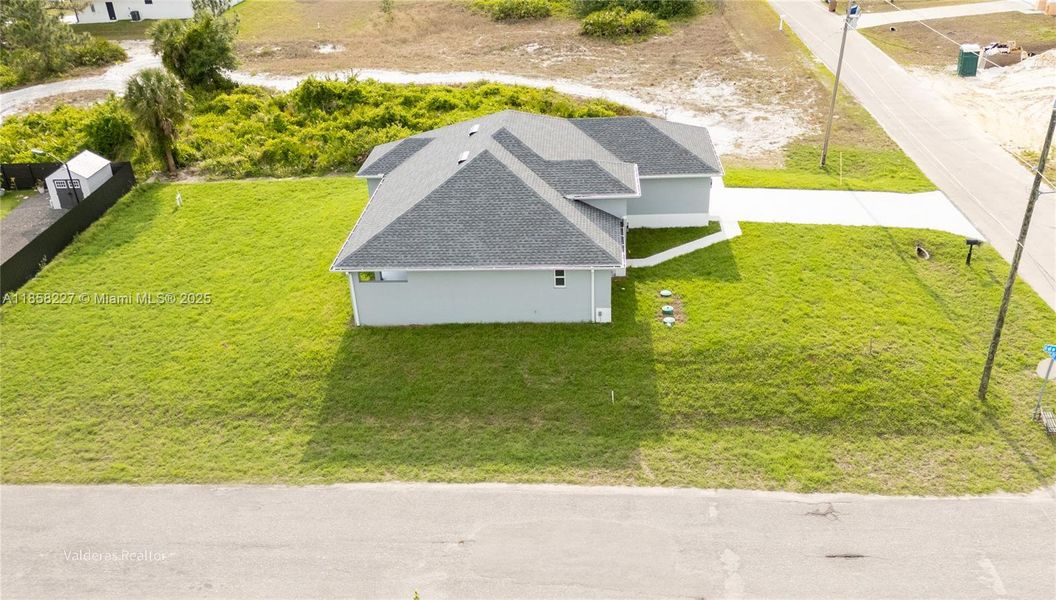 Front exterior of a new home in , Lehigh Acres, FL, highlighting curb appeal (Image 21).