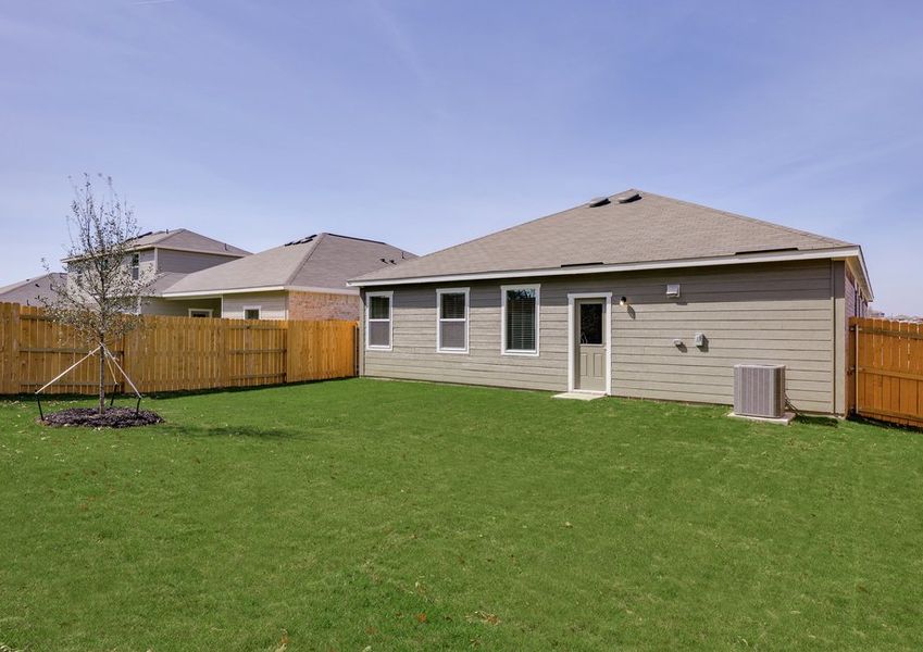 The back yard is fully fenced in.