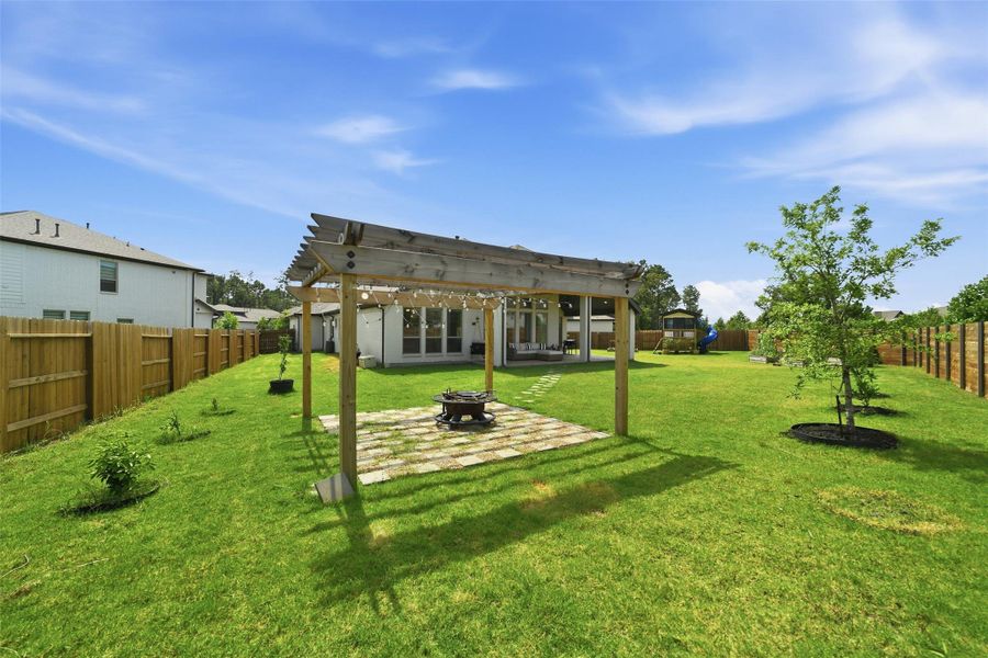 Exterior details and patio area of a home in Artavia, Conroe (Image 26).