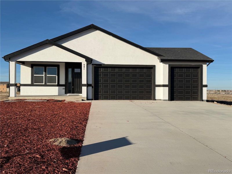 Front exterior of a new home in , Pueblo, CO, highlighting curb appeal (Image 1). Front exterior of a new home in , Pueblo, CO, highlighting curb appeal (Image 1).