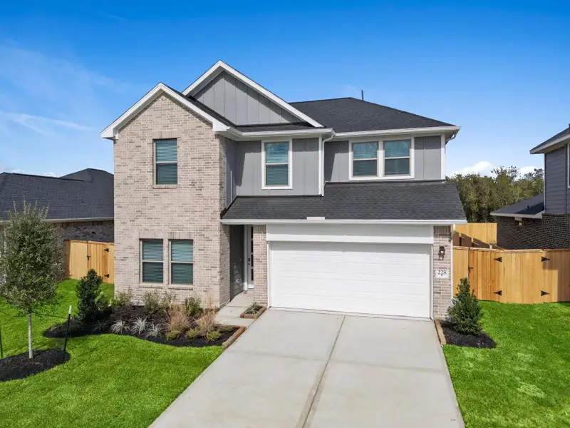 Front exterior of a new home in Laurel Landing, Alvin, TX, highlighting curb appeal (Image 2). Front exterior of a new home in Laurel Landing, Alvin, TX, highlighting curb appeal (Image 2).