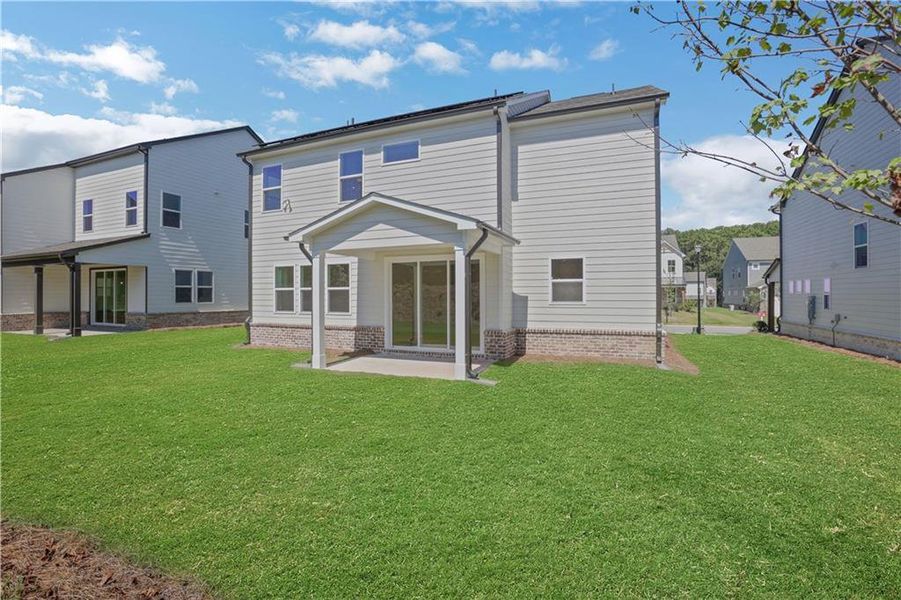 Exterior details and patio area of a home in The Paddocks at Doc Hughes, Buford (Image 24).
