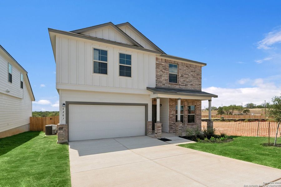 Front exterior of a new home in Mesquite Ridge, San Antonio, TX, highlighting curb appeal (Image 22). Front exterior of a new home in Mesquite Ridge, San Antonio, TX, highlighting curb appeal (Image 22).
