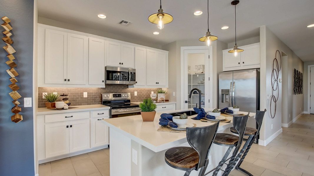 Explore the Bluebell kitchen interior by DRB Homes at Anderson Parc, Lot 171, 2158 S 242nd Lane in Buckeye, Arizona.