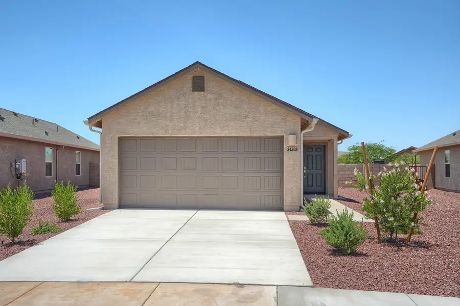 Front exterior of a new home in Red Rock Village, Red Rock, AZ, highlighting curb appeal (Image 1). Front exterior of a new home in Red Rock Village, Red Rock, AZ, highlighting curb appeal (Image 1).
