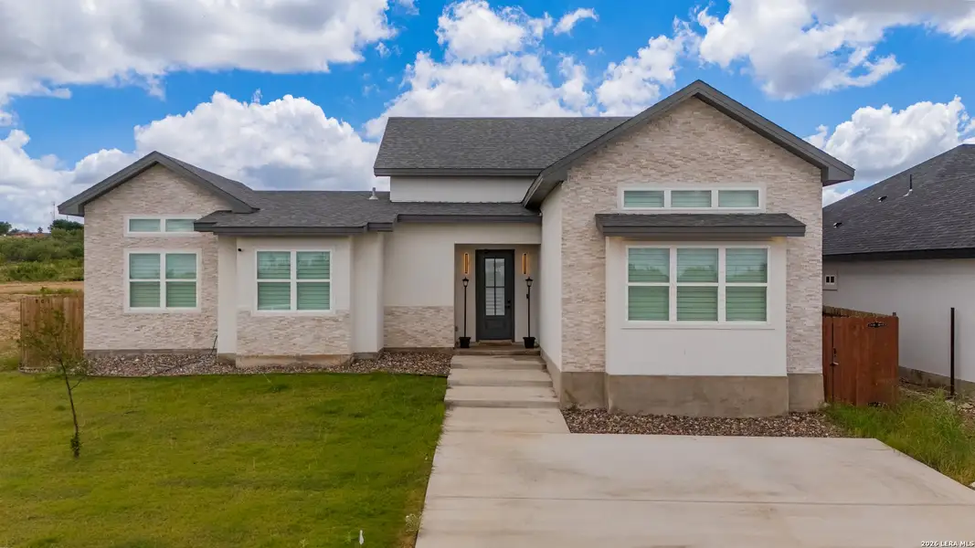 Front exterior of a new home in , Eagle Pass, TX, highlighting curb appeal (Image 25). Front exterior of a new home in , Eagle Pass, TX, highlighting curb appeal (Image 25).