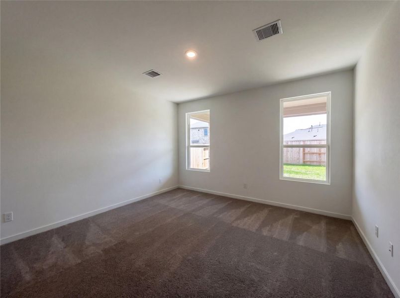 Spacious, unfurnished interior of a new home in Sunterra, Katy (Image 19).