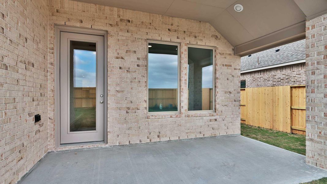 Exterior details and patio area of a home in Meridiana, Manvel (Image 4).