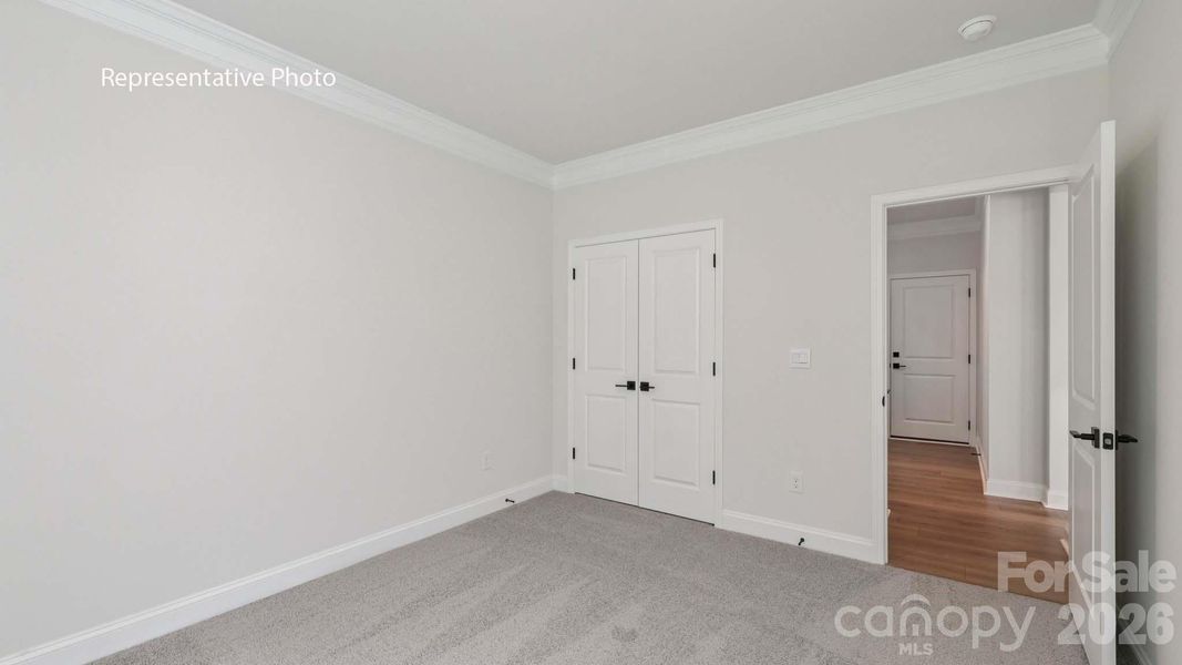 Spacious, unfurnished interior of a new home in Sanctuary at Southgate, Indian Trail (Image 12).