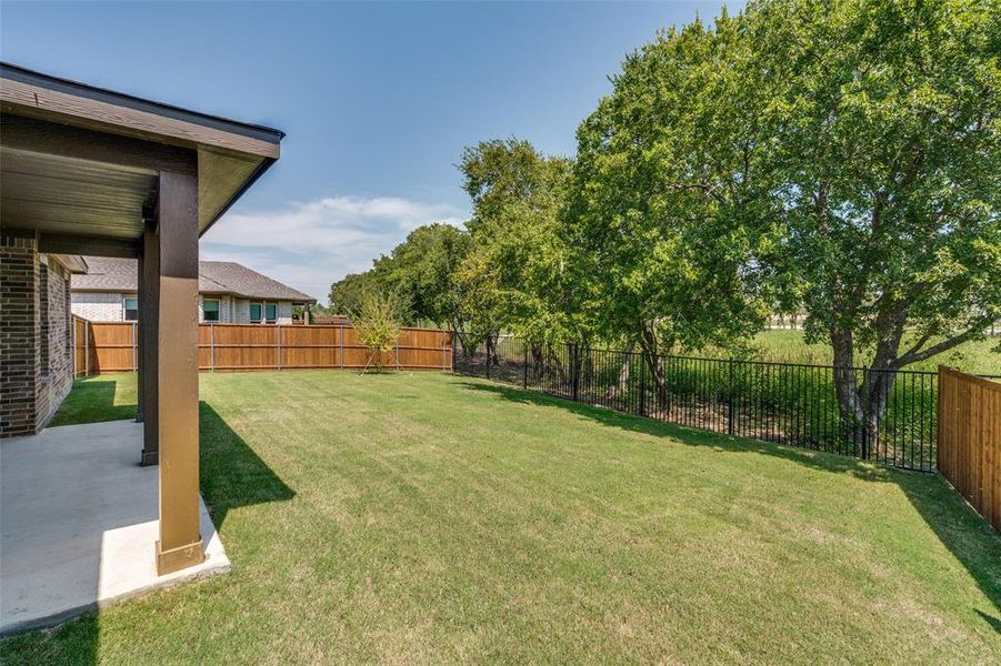 Front exterior of a new home in The Preserve Estates, Justin, TX, highlighting curb appeal (Image 20). Front exterior of a new home in The Preserve Estates, Justin, TX, highlighting curb appeal (Image 20).