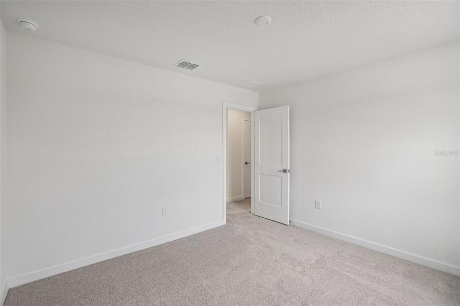 Spacious, unfurnished interior of a new home in Grasslands West, Lakeland (Image 33).