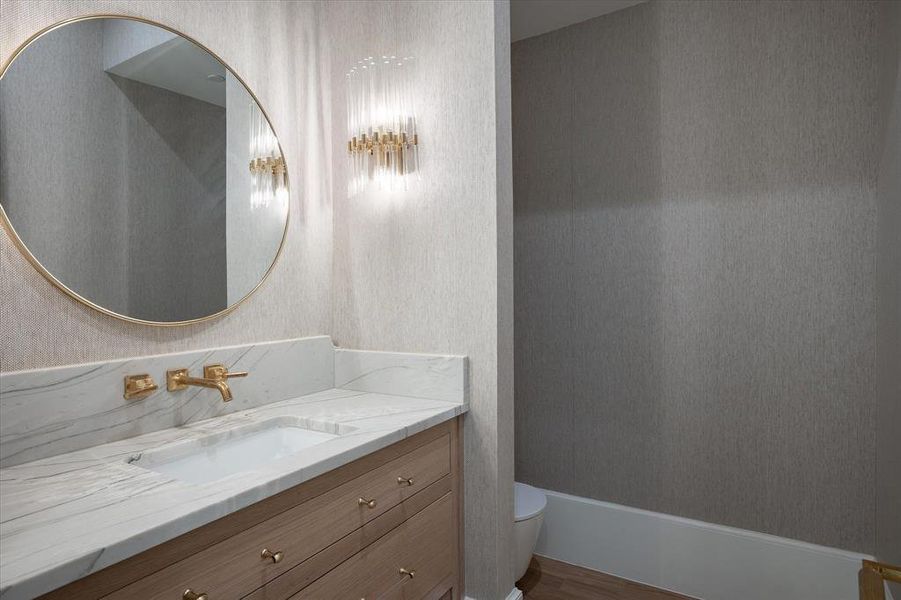 Bathroom featuring toilet, hardwood / wood-style flooring, and vanity