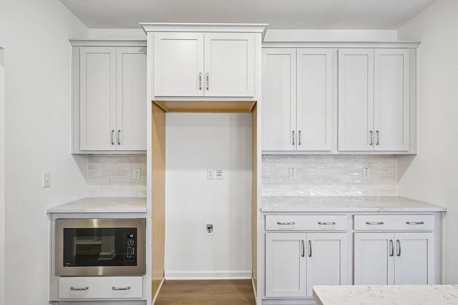 Kitchen featuring the AW Collection® Milan - Chic gray finishes and smooth surfaces shine. Kitchen featuring the AW Collection® Milan - Chic gray finishes and smooth surfaces shine.