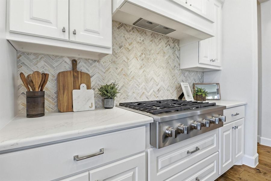 This is the kitchen that makes you want to cook again. Warm engineered hardwood floors anchor the space with just the right amount of warmth. This is where Sunday morning pancakes and dinner party memories are made. Come see it for yourself.