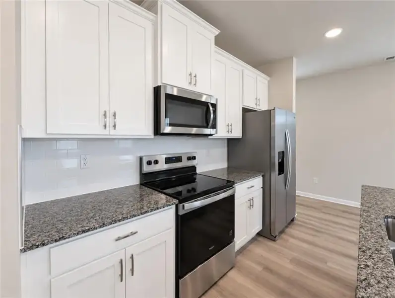 Furnished interior view inside a new home in Walden Park – The Retreat, Lithonia (Image 9).