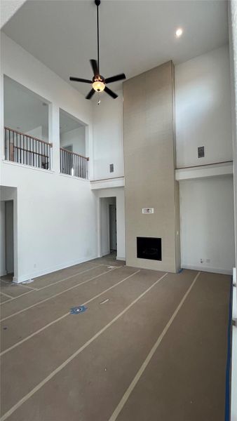 Bright Family Room with soaring ceiling and Fireplace