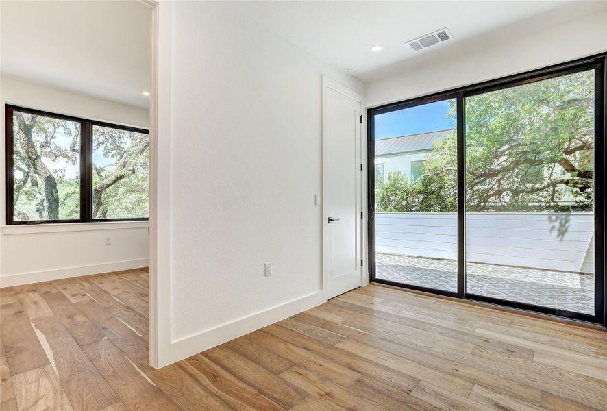 Unfurnished room with light wood-style flooring, baseboards, and recessed lighting