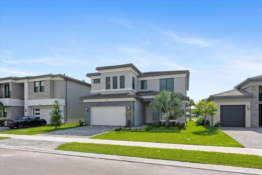 Front exterior of a new home in , Boca Raton, FL, highlighting curb appeal (Image 1). Front exterior of a new home in , Boca Raton, FL, highlighting curb appeal (Image 1).