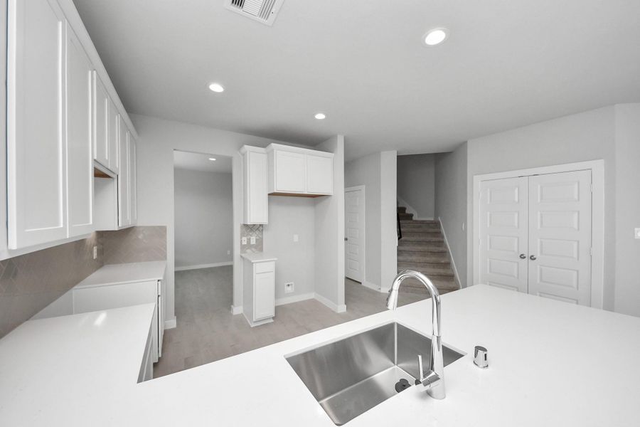 This generously spacious kitchen is a dream realized! Sample photo of completed home with similar floor plan. Actual colors and selections may vary. This generously spacious kitchen is a dream realized! Sample photo of completed home with similar floor plan. Actual colors and selections may vary.