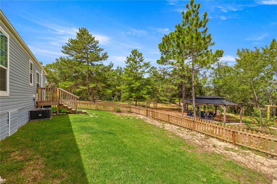 Front exterior of a new home in , Ocklawaha, FL, highlighting curb appeal (Image 1).