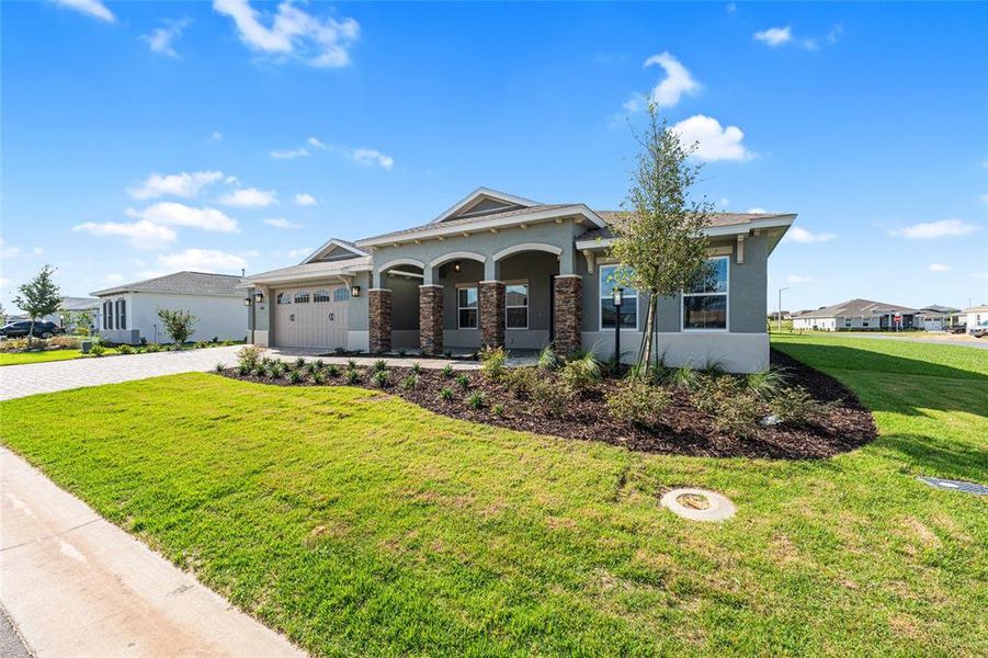 Front exterior of a new home in , Ocala, FL, highlighting curb appeal (Image 2). Front exterior of a new home in , Ocala, FL, highlighting curb appeal (Image 2).