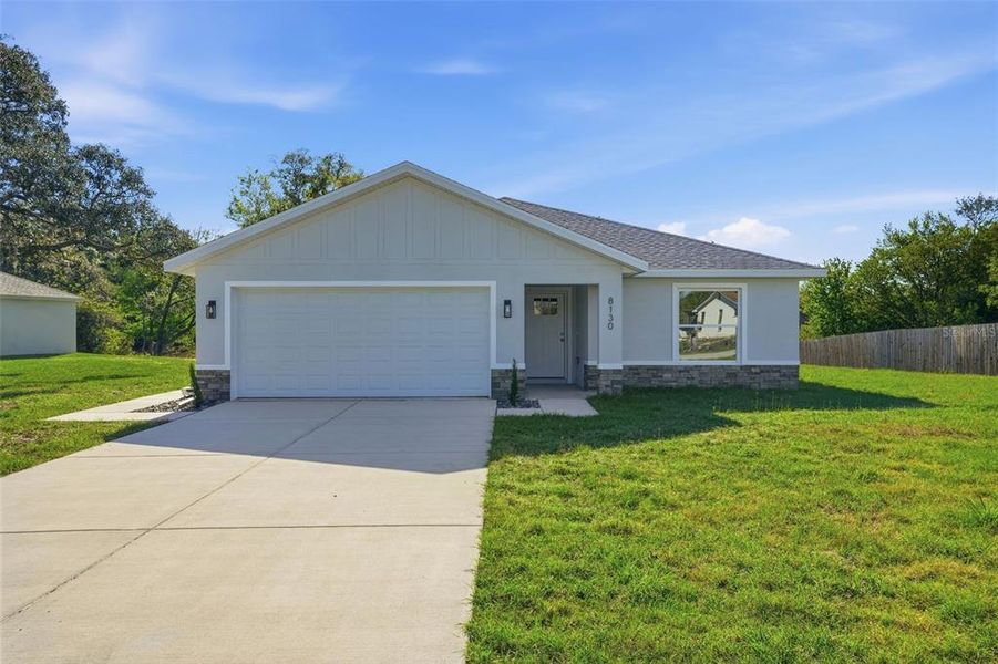 Front exterior of a new home in , Weeki Wachee, FL, highlighting curb appeal (Image 26). Front exterior of a new home in , Weeki Wachee, FL, highlighting curb appeal (Image 26).