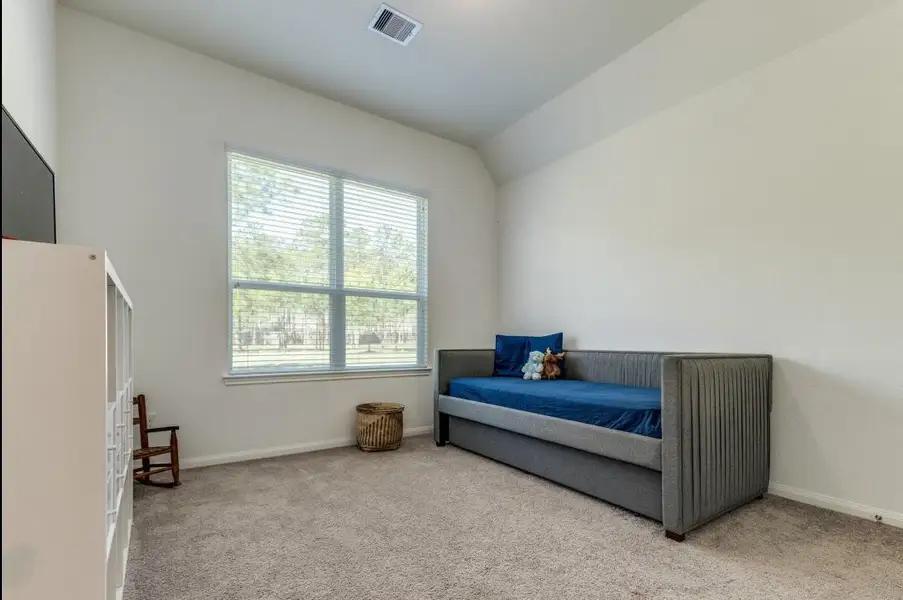 Furnished interior view inside a new home in Deer Pines, Conroe (Image 9).