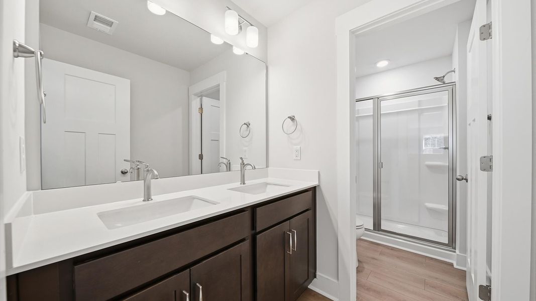 Top-notch bathroom with current fixtures, tasteful materials, and elevated charm at Creeks at Midway