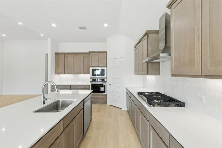 Kitchen in the Gilmour II home plan by Trophy Signature Homes – REPRESENTATIVE PHOTO Kitchen in the Gilmour II home plan by Trophy Signature Homes – REPRESENTATIVE PHOTO