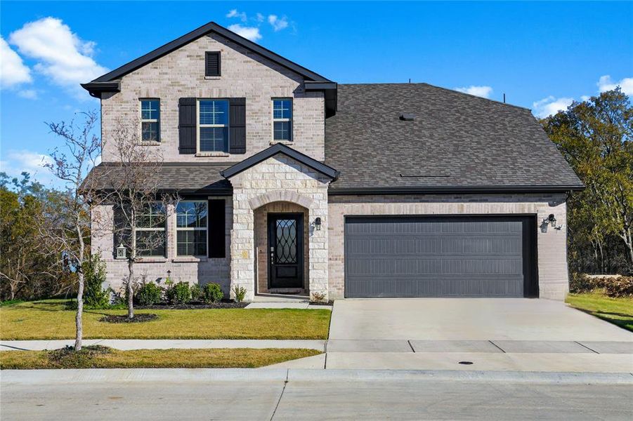 Front exterior of a new home in Stark Farms, Denton, TX, highlighting curb appeal (Image 29).