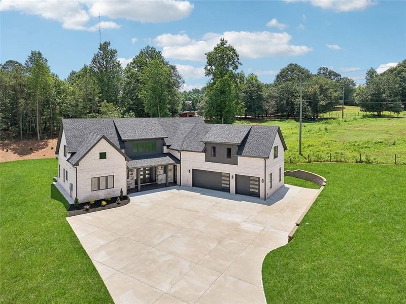Front exterior of a new home in , Braselton, GA, highlighting curb appeal (Image 46). Front exterior of a new home in , Braselton, GA, highlighting curb appeal (Image 46).