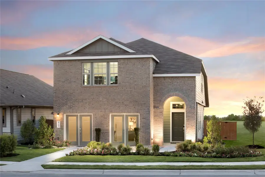 Front exterior of a new home in Woodfield Preserve, Georgetown, TX, highlighting curb appeal (Image 15).