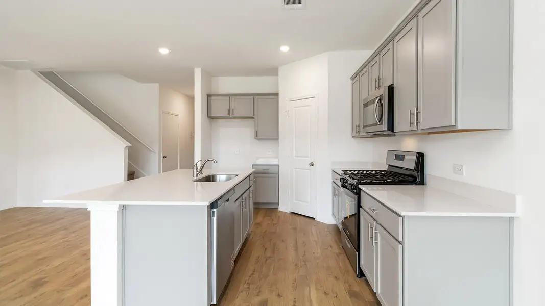 Furnished interior view inside a new home in Bar W Ranch, Leander (Image 11).