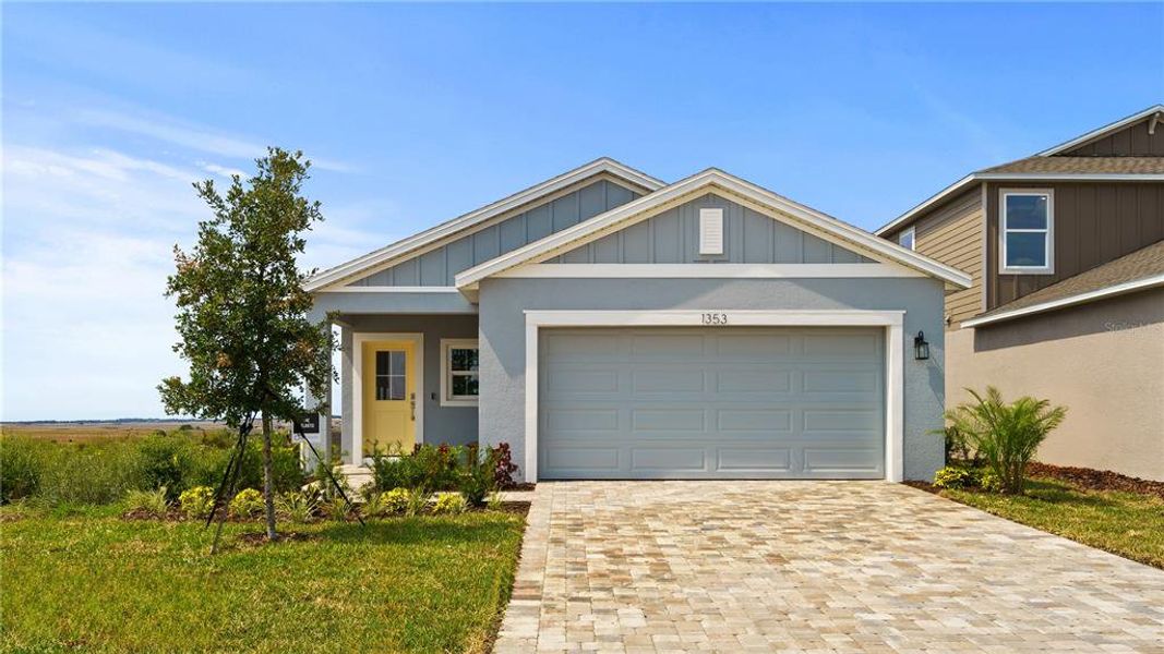 Front exterior of a new home in Hamilton Bluff, Haines City, FL, highlighting curb appeal (Image 21).