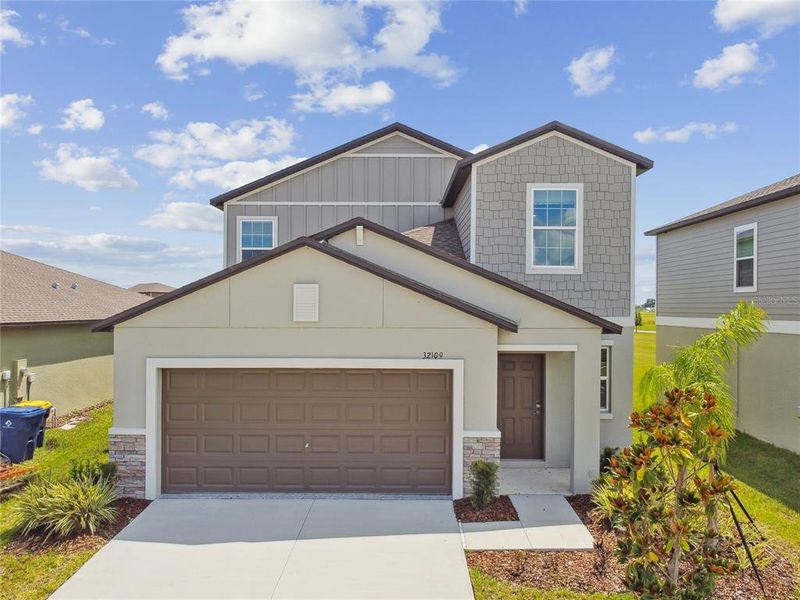 Front exterior of a new home in , San Antonio, FL, highlighting curb appeal (Image 2).