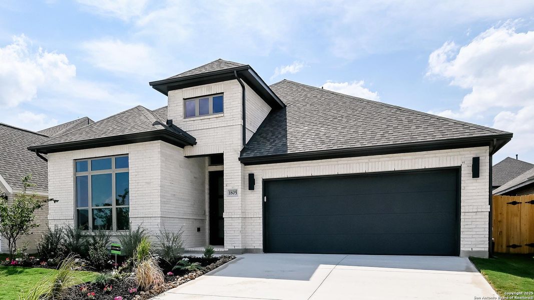 Front exterior of a new home in Meadows Of Mill Creek 50', Seguin, TX, highlighting curb appeal (Image 2).